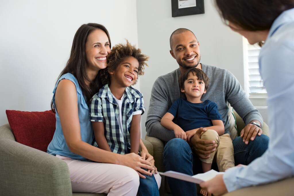 Parents Smiling With Their Children