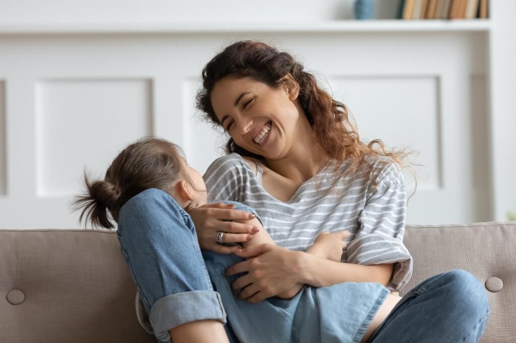 Daughter Smiling With Her Mom