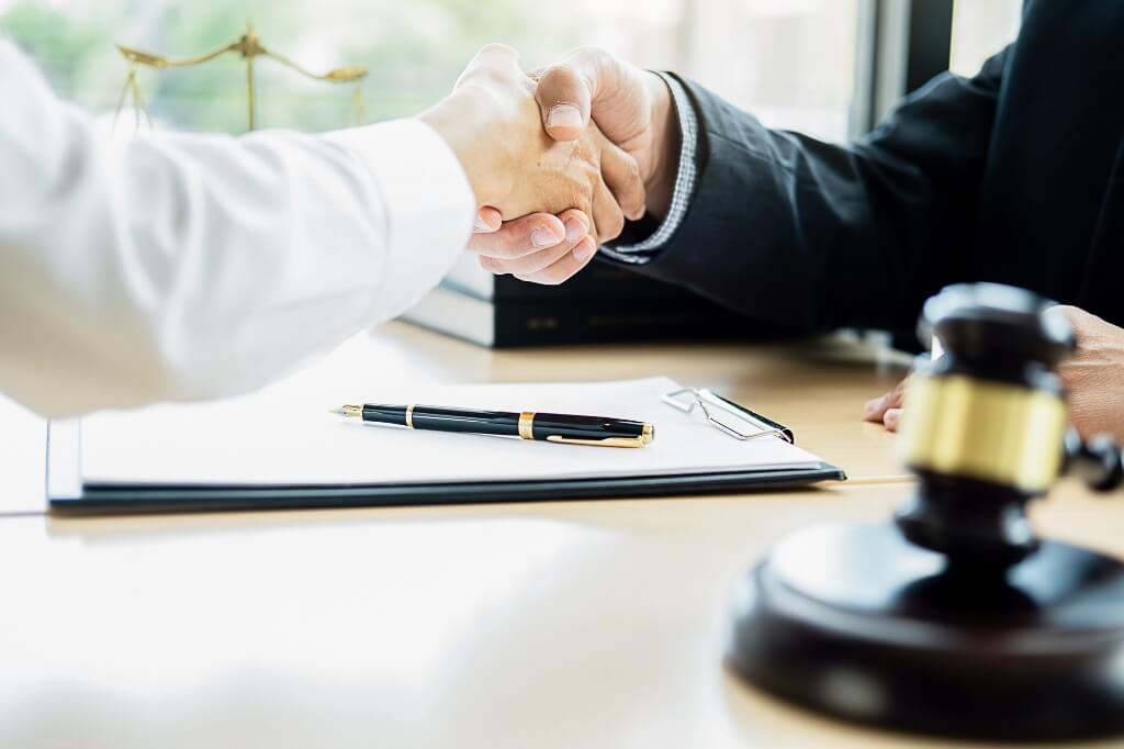 Lawyer Shaking Hands With His Client