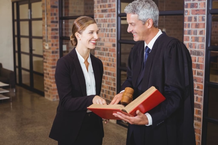 Lawyers Smiling And Holding Legal Docs